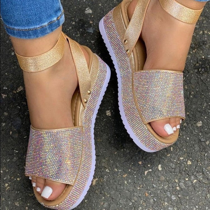 Women's polished chunky platform sandals with secure ankle strap, perfect for glamorous party wear.