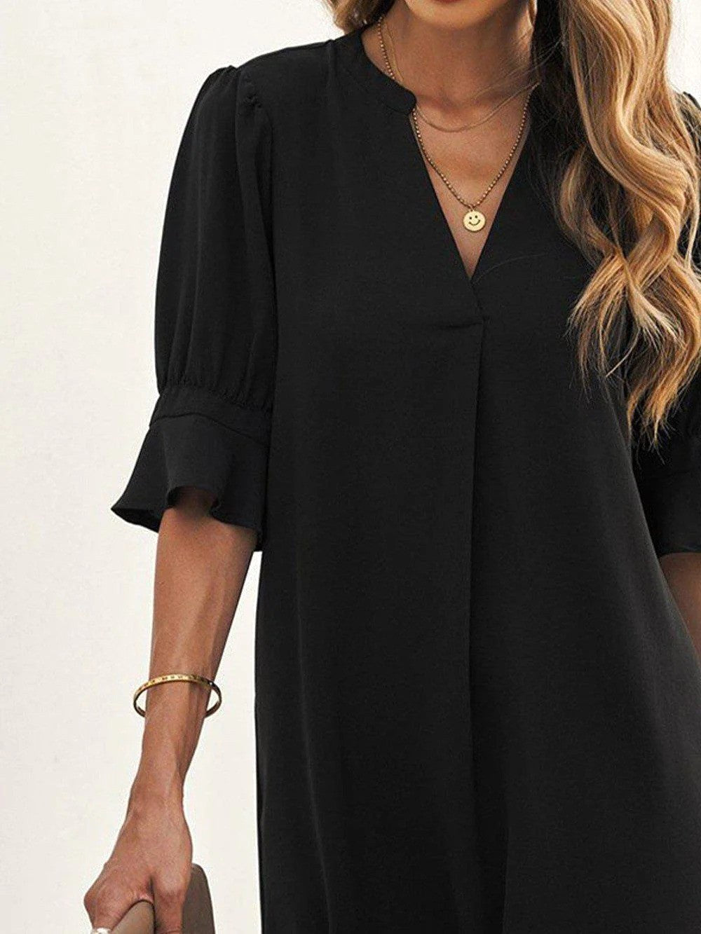 Timeless black midi dress for women, a comfortable and flattering wardrobe staple for any occasion.