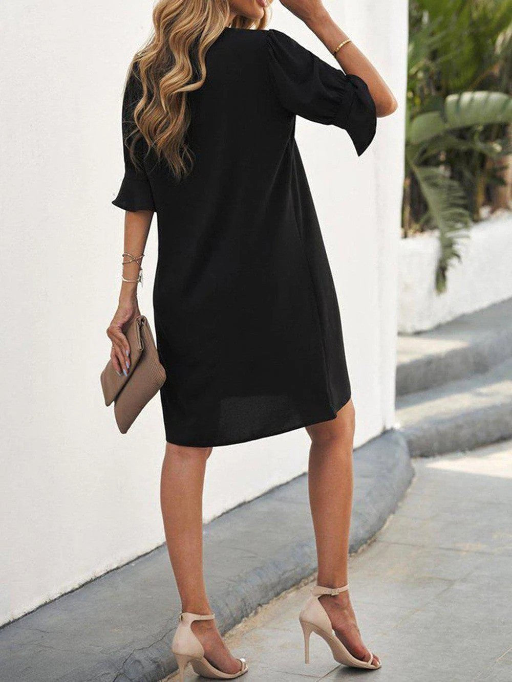 Classic women's black midi dress, offering effortless elegance and versatile style for modern fashion.