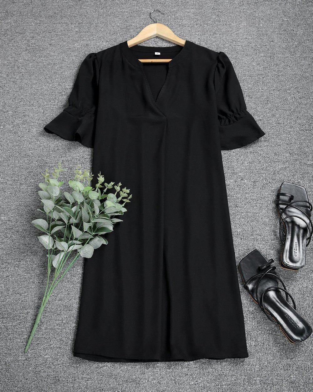Versatile women's black midi dress, perfect for a party dress or elegant everyday wear.