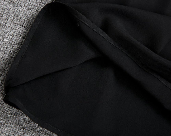 Comfortable black midi dress for women, a stylish and flattering choice for classic everyday fashion.