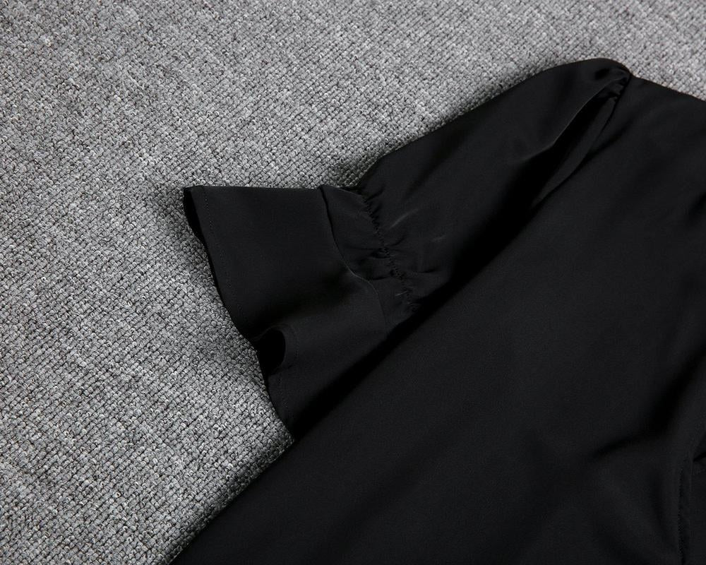 Stylish women's black midi dress, a versatile and elegant piece for any wardrobe, suitable for parties.