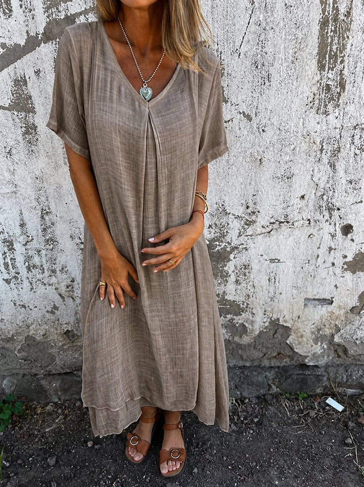 Women's relaxed fit V-neck flowy maxi dress in soft fabric, perfect for cozy casual summer everyday wear.