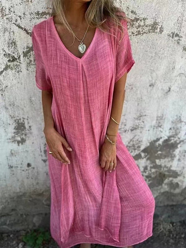 Women's V-neck flowy maxi dress with a relaxed fit & short sleeves, a comfortable boho chic casual summer dress.