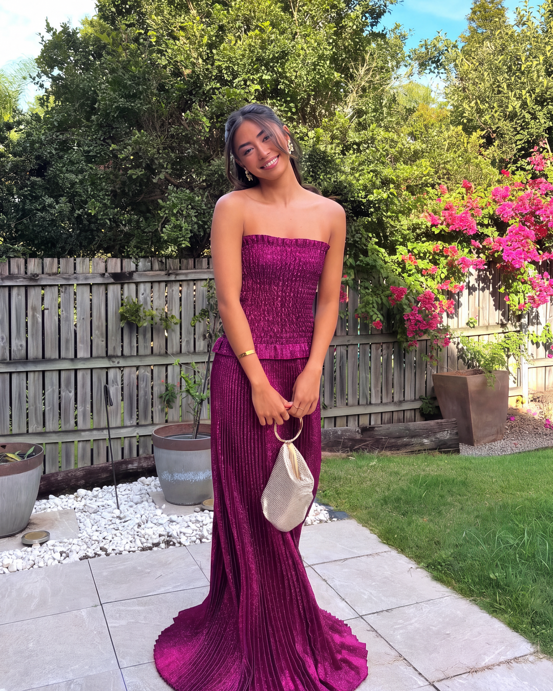 Shimmering berry sequin detail on a women's strapless maxi dress. Perfect for a glamorous evening party.