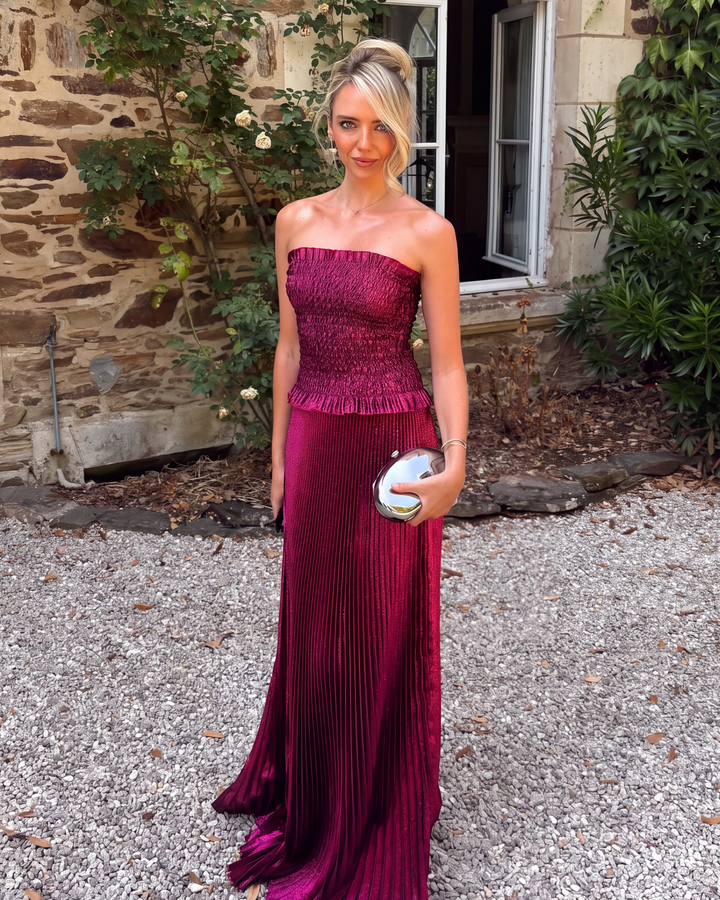 Model wearing a stunning berry strapless sequin maxi dress, ideal formal evening gown for a statement look.