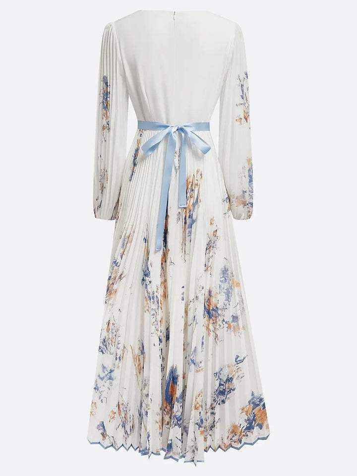 Stylish women's white V-neck floral maxi dress with elegant puff sleeves, great for formal spring wear.