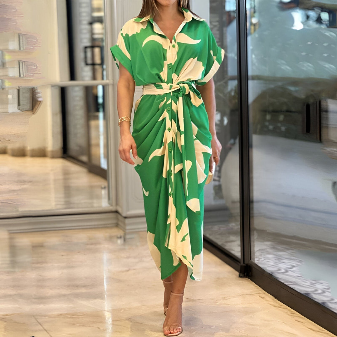 Women's stylish collared belted midi dress with an elegant abstract print, perfect for summer garden parties.