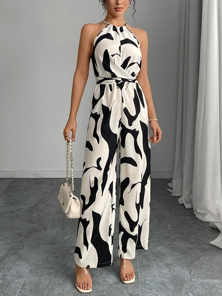 Women's abstract print wide-leg jumpsuit with tie waist. Perfect for summer fashion & elegant casual wear.