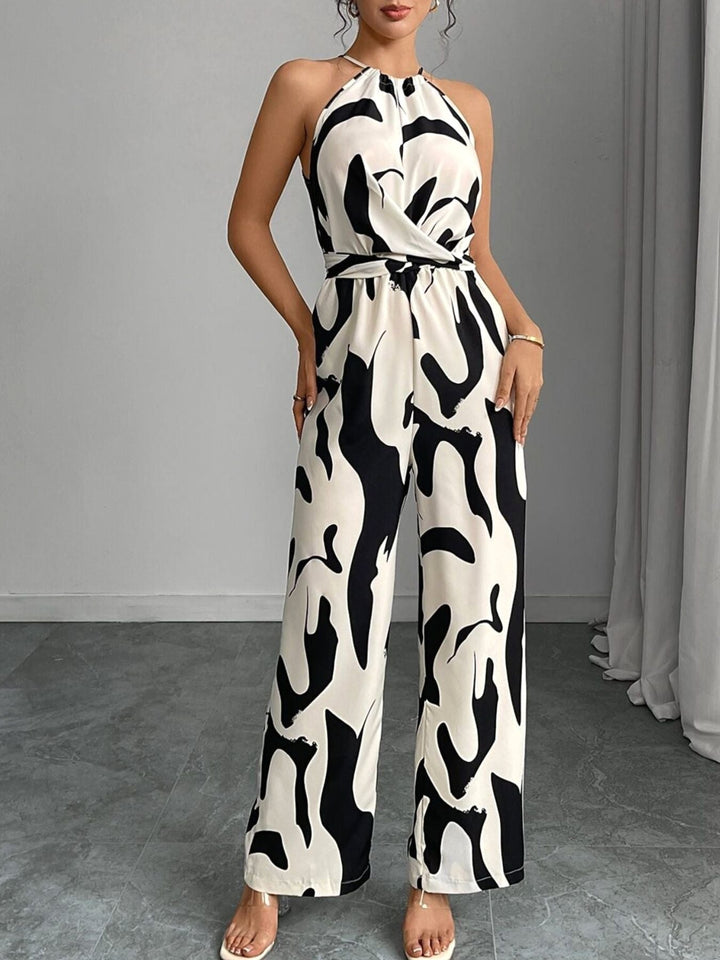 Stylish women's wide-leg jumpsuit featuring a unique abstract print. Ideal one-piece for vacation or event wear.