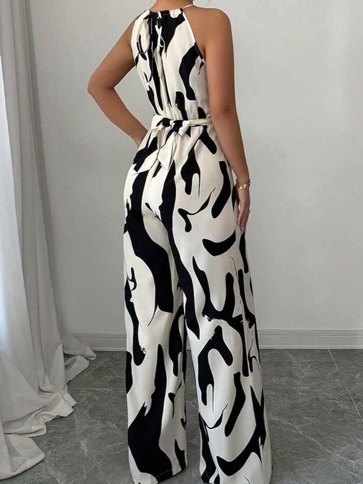 Flowy women's abstract print wide-leg jumpsuit, a comfortable one-piece for effortless summer style & events.
