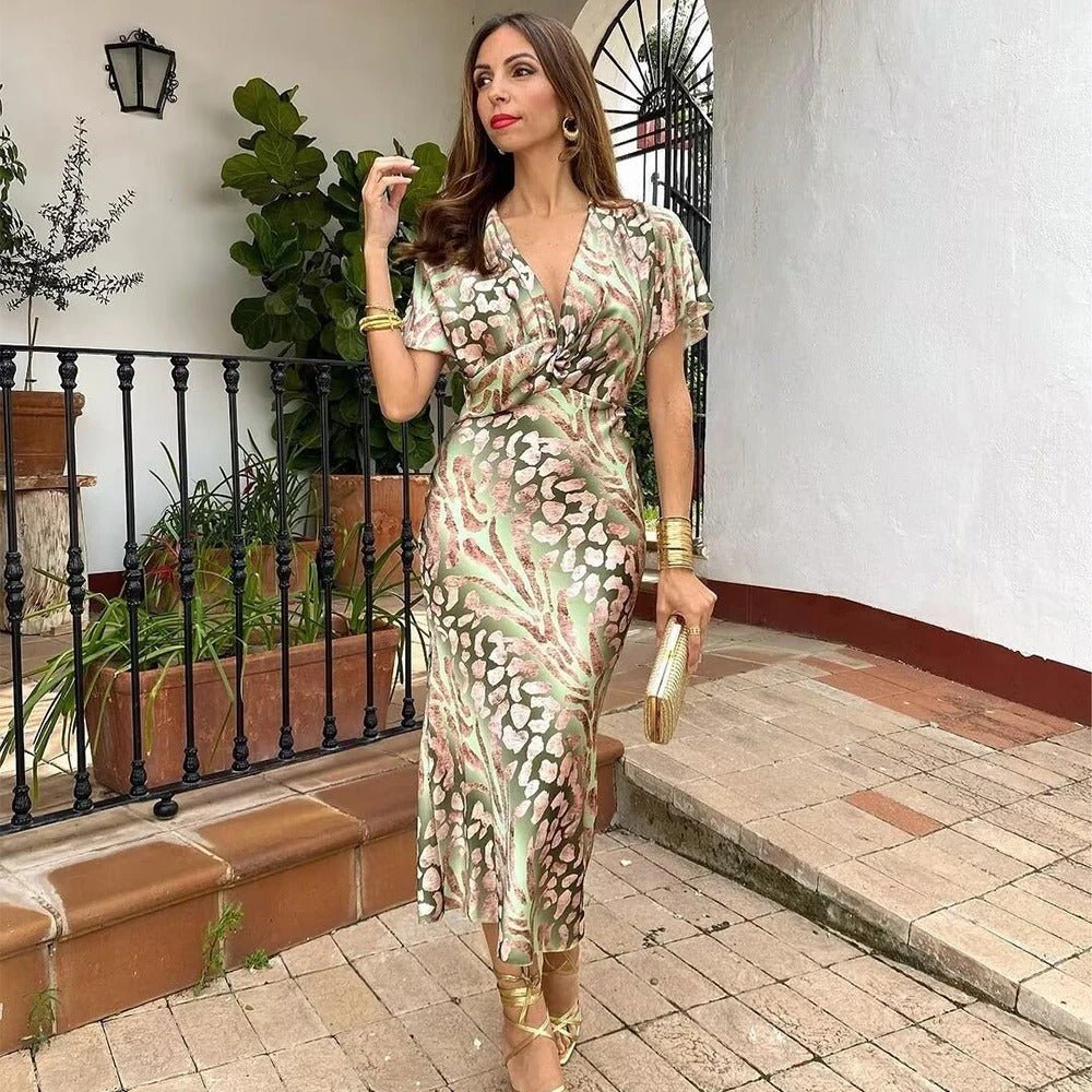 Elegant women's floral wrap front midi cocktail dress with flattering fit, perfect for special occasions.