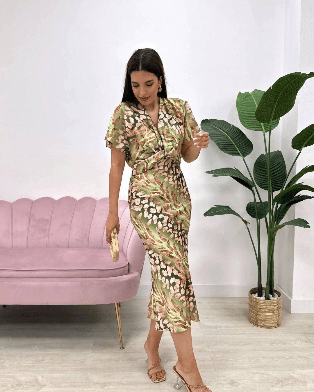 Chic floral wrap midi cocktail dress for women, featuring a flattering V-neck and delicate flutter sleeves.