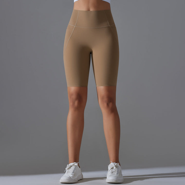 Women's high-waisted bike shorts with pockets, ideal for yoga & gym workouts.