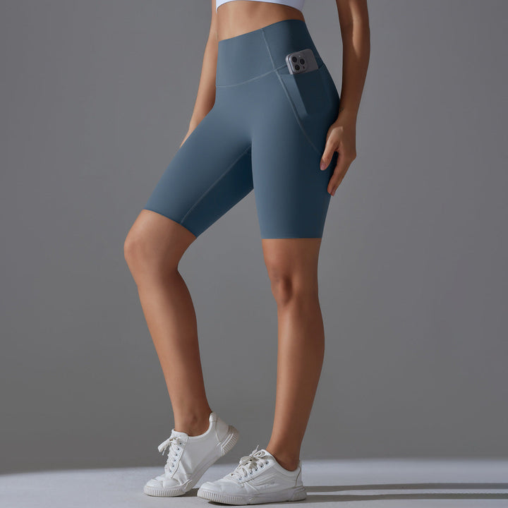 Durable women's bike shorts, high waist & pockets for gym, yoga, or cycling.