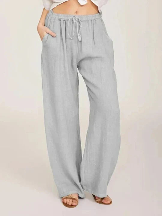 Women's chic light blue wide leg drawstring pants. Comfortable, relaxed fit flowy pants perfect for summer & travel.