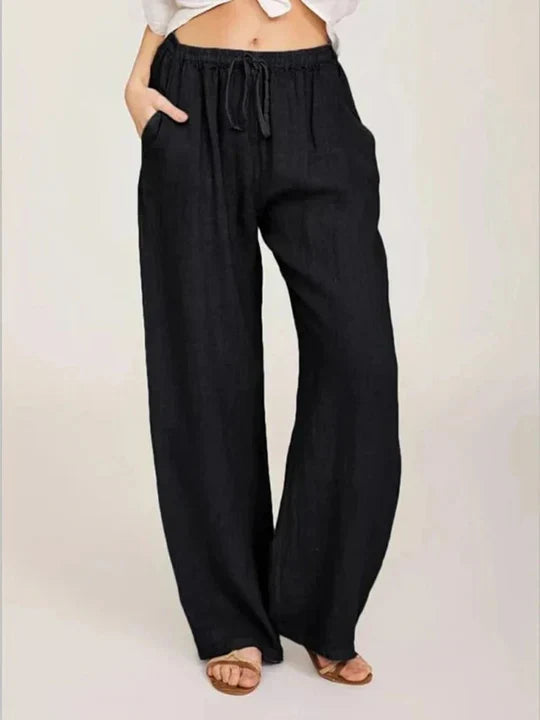 Grey women's wide leg drawstring pants, offering casual comfort & a relaxed fit. Versatile flowy pants for summer style.