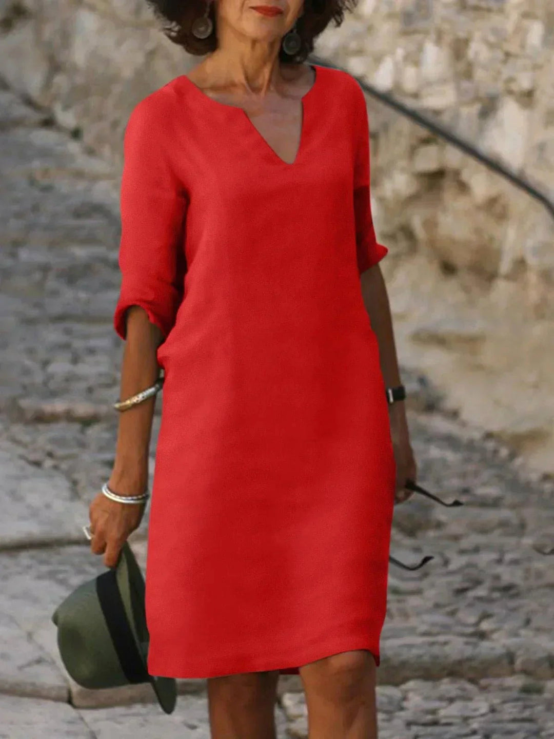 Sophisticated women's V-neck midi dress, flattering and chic for summer party events.