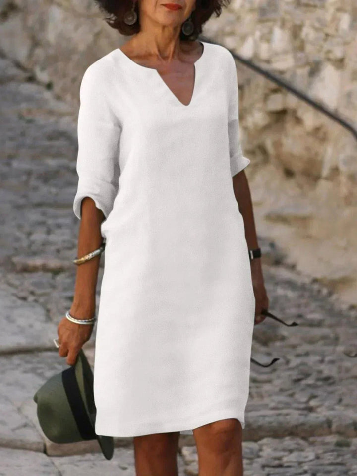 Lovely women's V-neck midi dress, elegant summer occasionwear with a flattering silhouette.