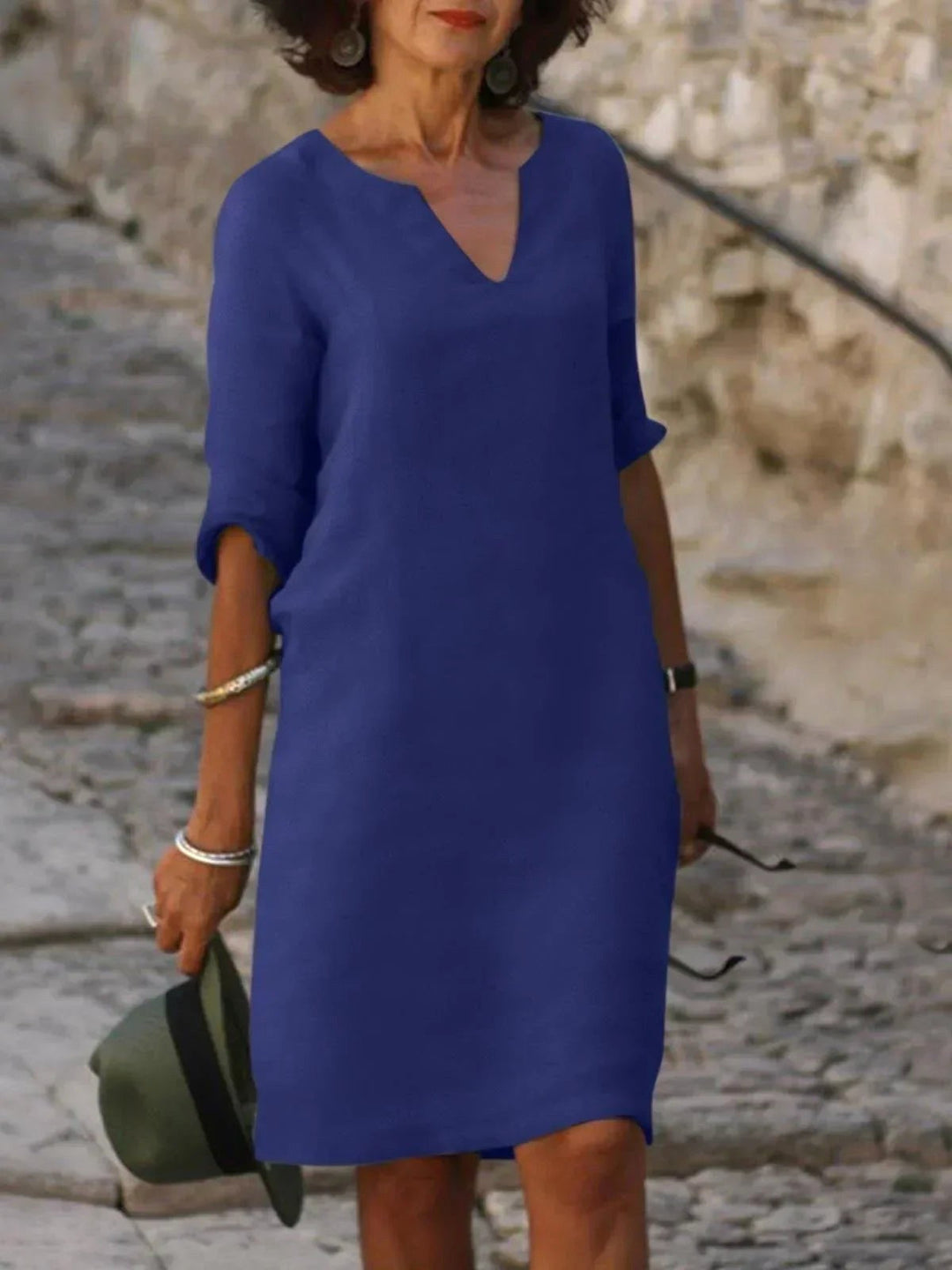 Graceful women's V-neck midi dress, elegant occasionwear for summer and evening events.