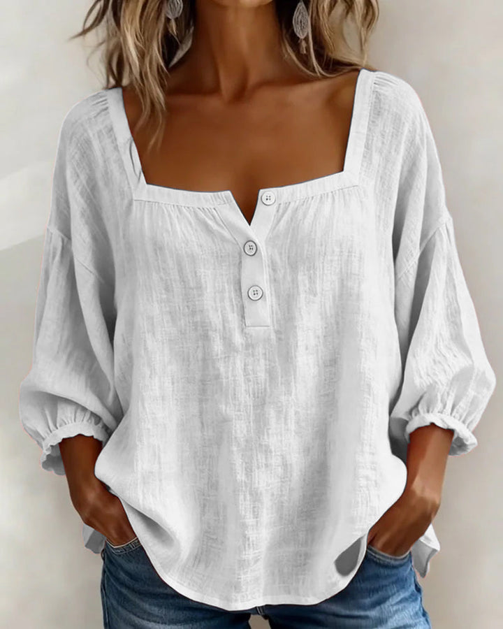 Relaxed fit women's linen blouse with a stylish square neck & comfortable balloon sleeves. Versatile everyday wear.