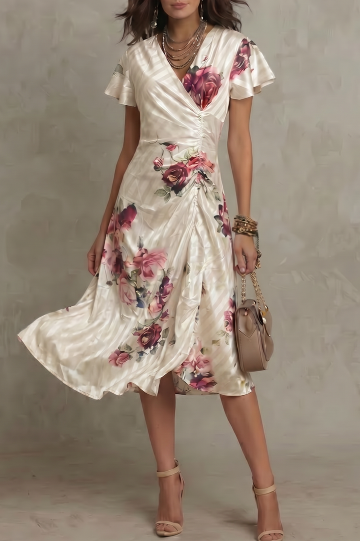 Women's ivory floral wrap cocktail midi dress. Elegant and flowy, perfect for parties or wedding guests.