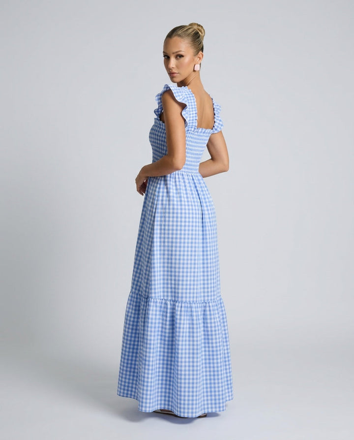 Casual chic women's maxi dress: gingham print, square neck, smocked bodice, and graceful ruffle sleeves.