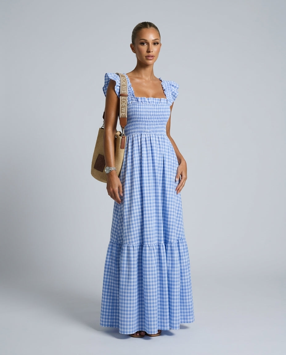 Front view of a women's refined maxi gingham dress with smocked bodice & fashionable ruffle sleeves.