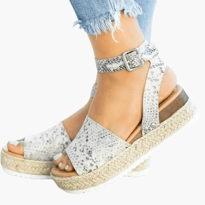 Comfortable women's leopard print espadrille wedge sandals, peep toe design for elegant summer style.