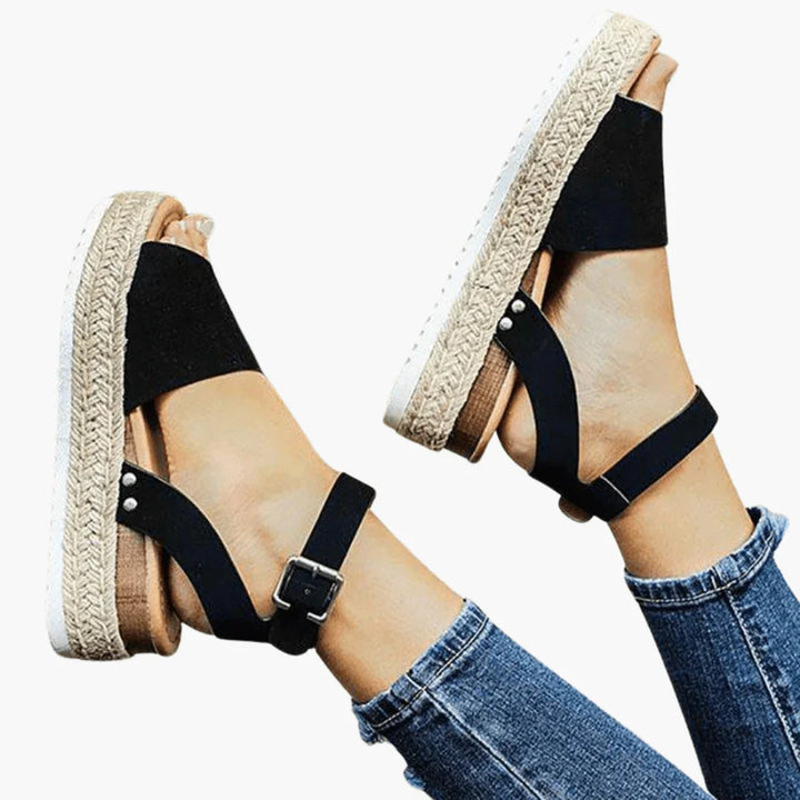 Women's animal print espadrille wedge sandals, featuring a stylish design & comfortable wear.