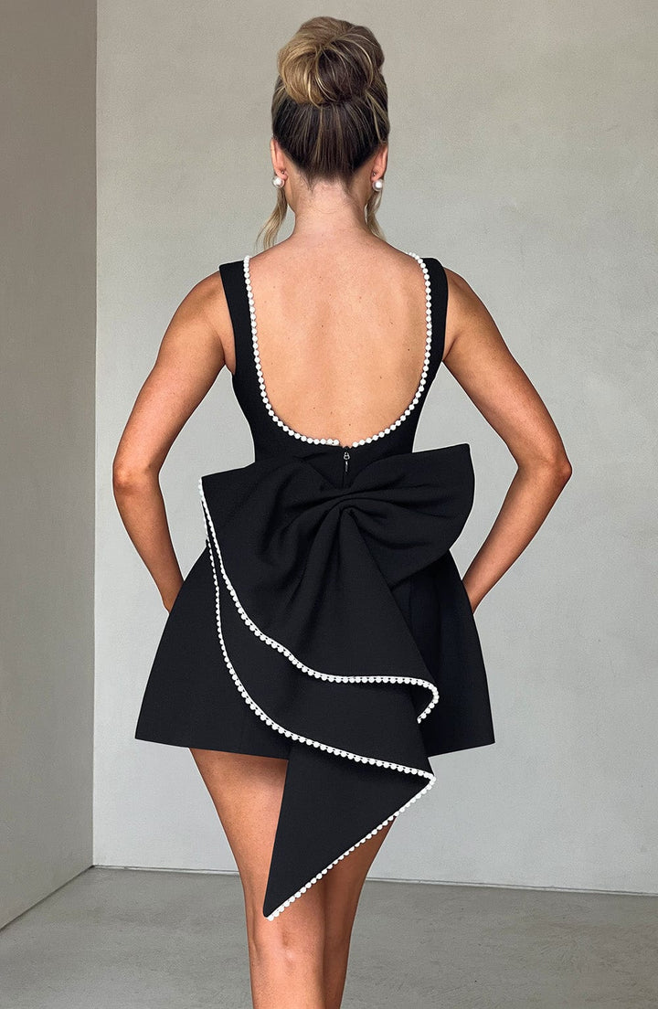 Fashionable women's pearl trim A-line sleeveless mini dress. Ideal for cocktail parties & special events.