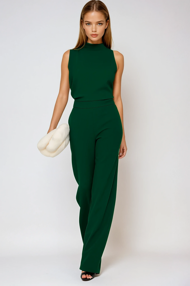 Emerald green sleeveless wide leg jumpsuit with elegant mock neck, perfect for evening wear.