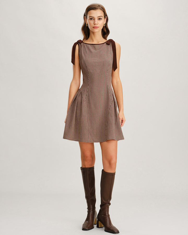 Sophisticated women's tie strap mini dress in classic gingham print. Comfortable day dress style.