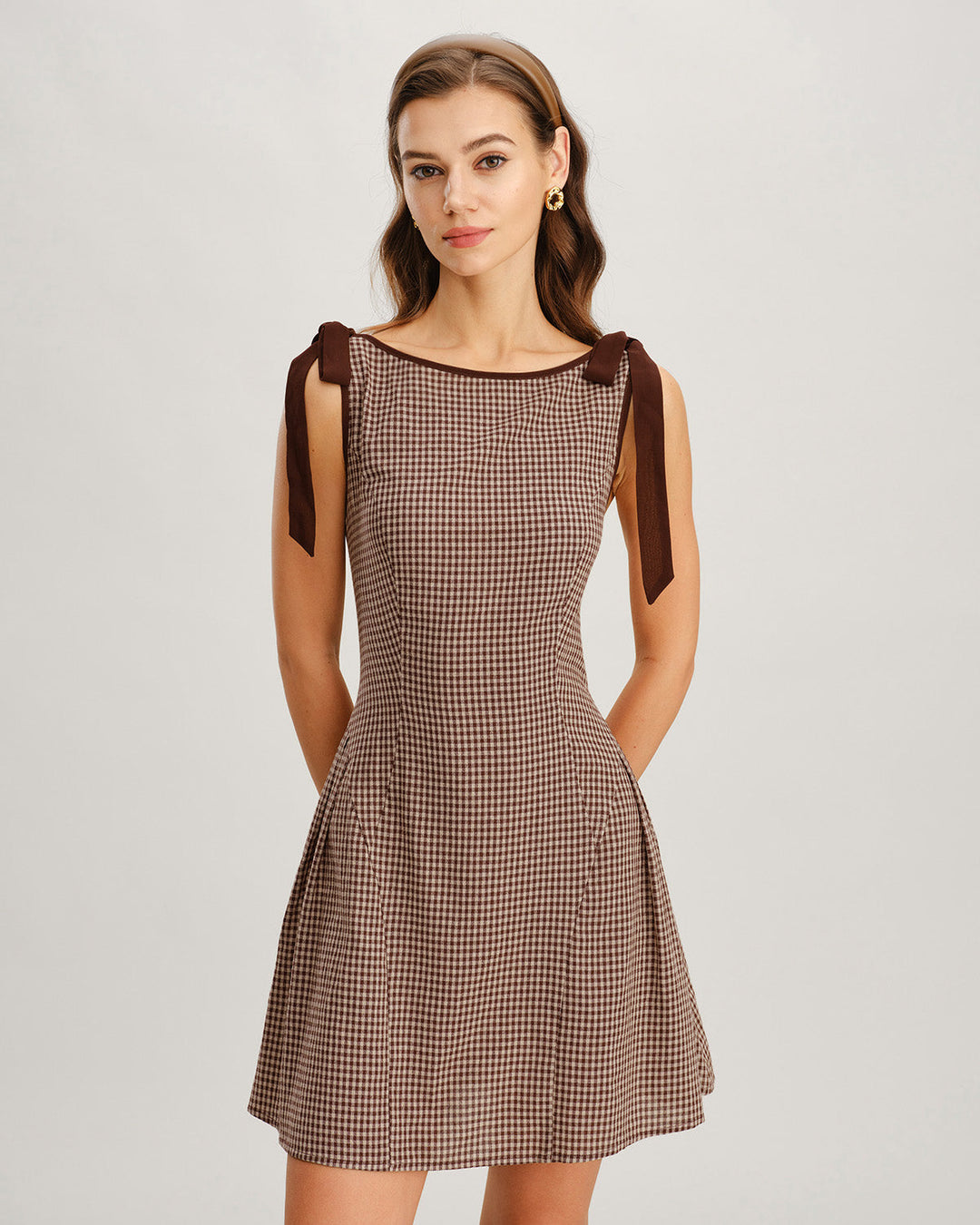 Classic gingham pattern mini dress for women with trendy tie straps. A perfect elegant summer style.