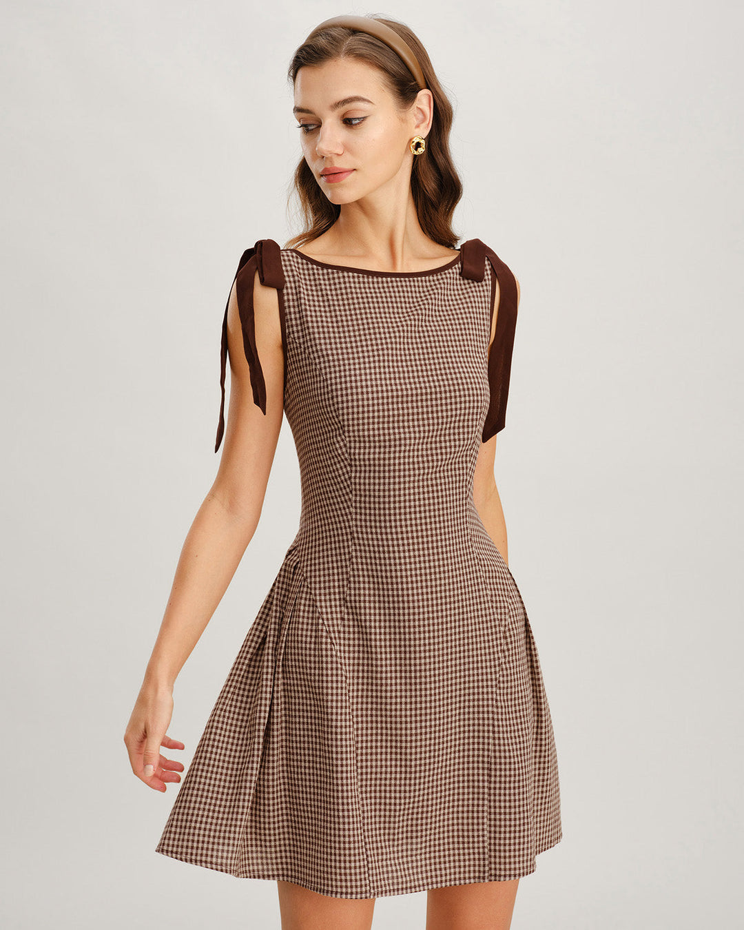 Trendy women's fit and flare tie strap gingham mini dress. Fashionable choice for a summer day dress.