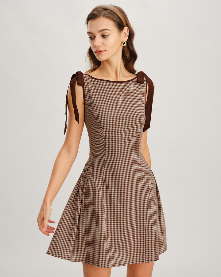 Trendy women's fit and flare tie strap gingham mini dress. Fashionable choice for a summer day dress.