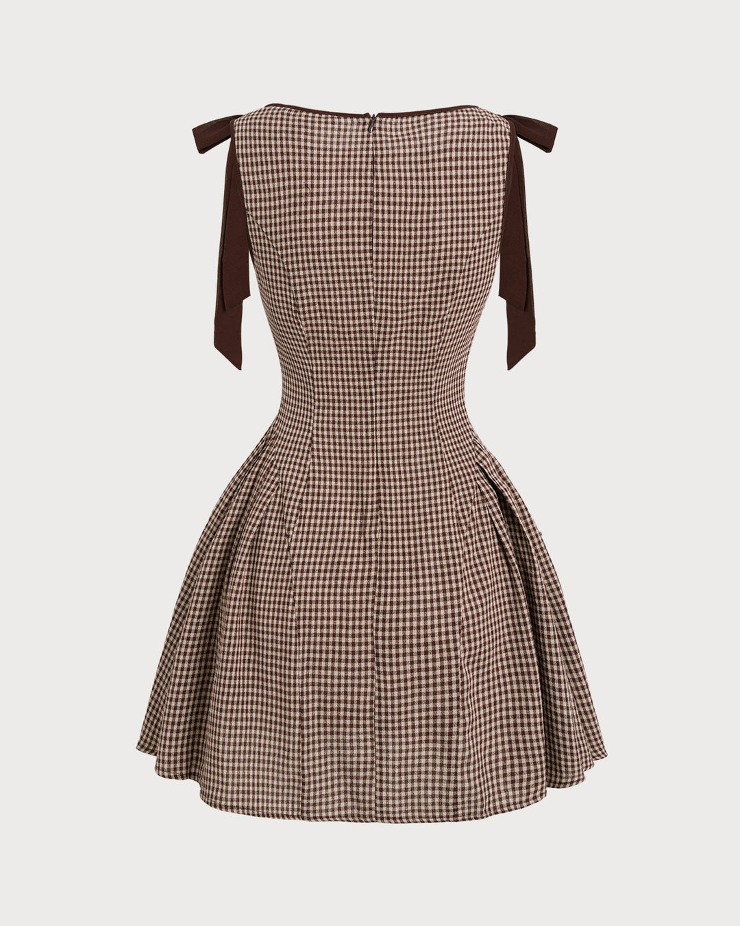 Brown gingham mini dress for women with sophisticated tie straps. Elegant fit and flare brunch dress.