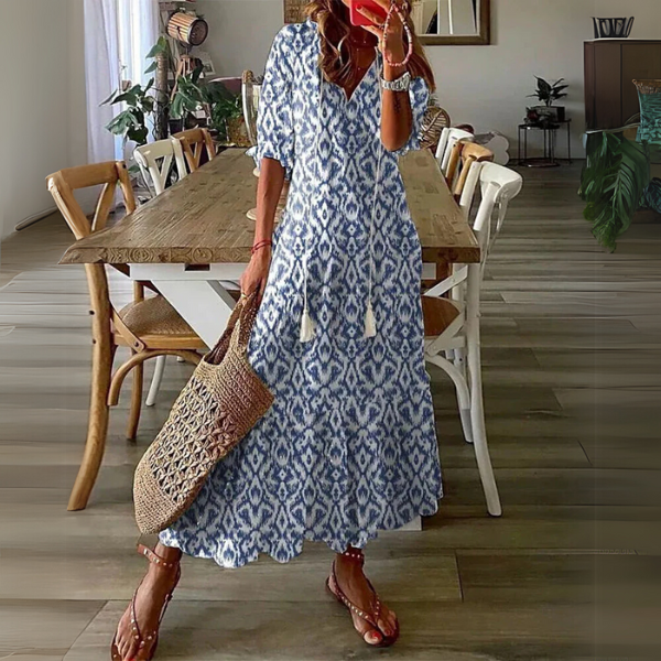 Elegant women's paisley print boho maxi dress with V-neck, three-quarter sleeves, and tassel ties.
