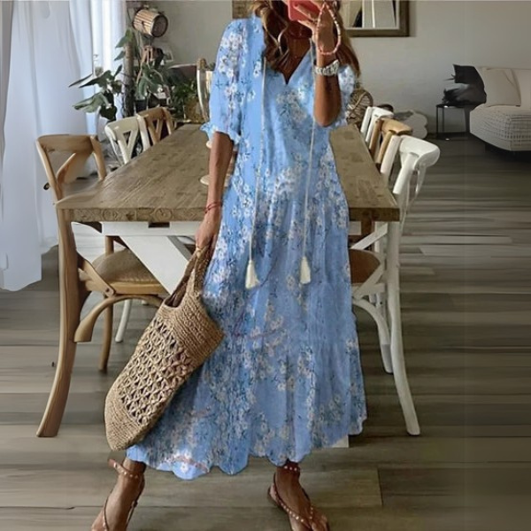 Stylish women's bohemian maxi dress, a flowy paisley print with elegant tiered skirt and V-neck.