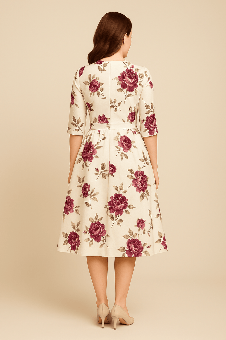 Stylish women's A-line midi cocktail dress with vibrant floral print, puffed sleeves & round neck. Perfect for parties.
