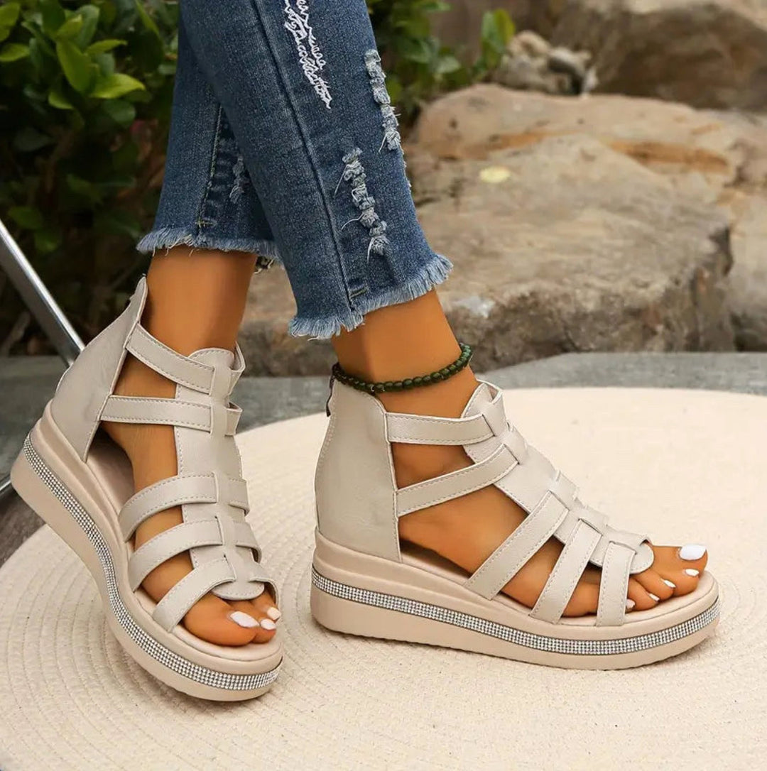 Stylish women's wedge sandals with a comfortable lift, perfect elegant footwear for any occasion.
