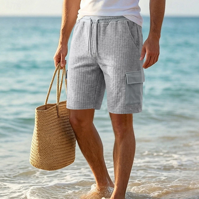 Comfortable men's cargo shorts with multiple utility pockets, ideal for summer casual wear and everyday activities.