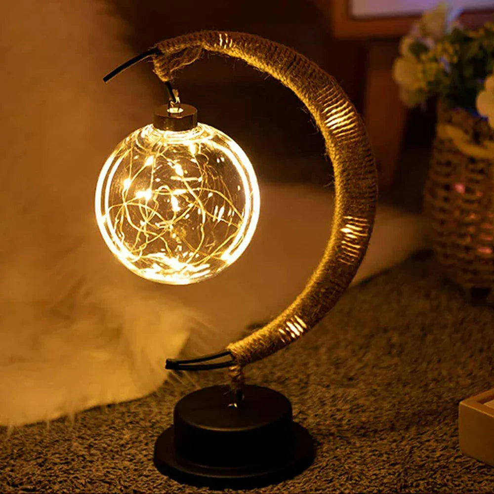 Ambient LED moonlight lamp illuminating a cozy bedroom. Perfect wireless celestial decor & night light.