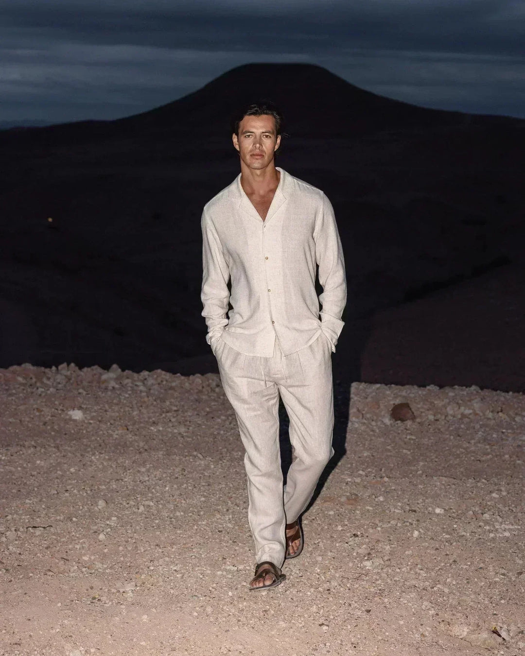 Stylish men's beige Cuban collar long sleeve shirt and casual pants set, perfect for relaxed summer fashion.