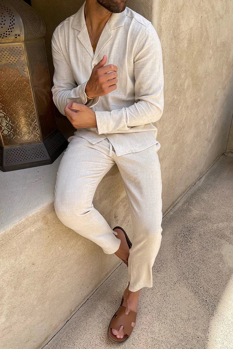 Beige two-piece men's Cuban collar long sleeve shirt & pants for smart casual resort or travel wear.