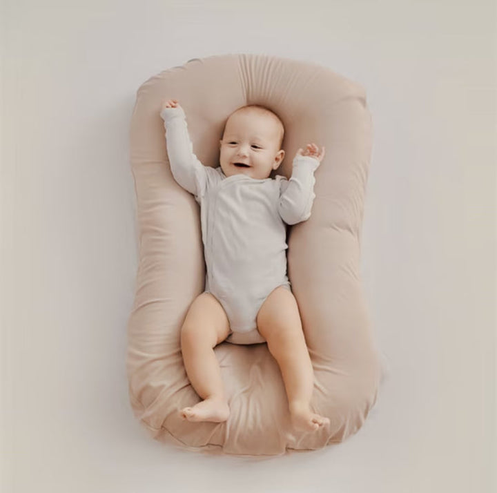 Ergonomic baby pillow for safe infant sleep and head support, preventing flat head syndrome.