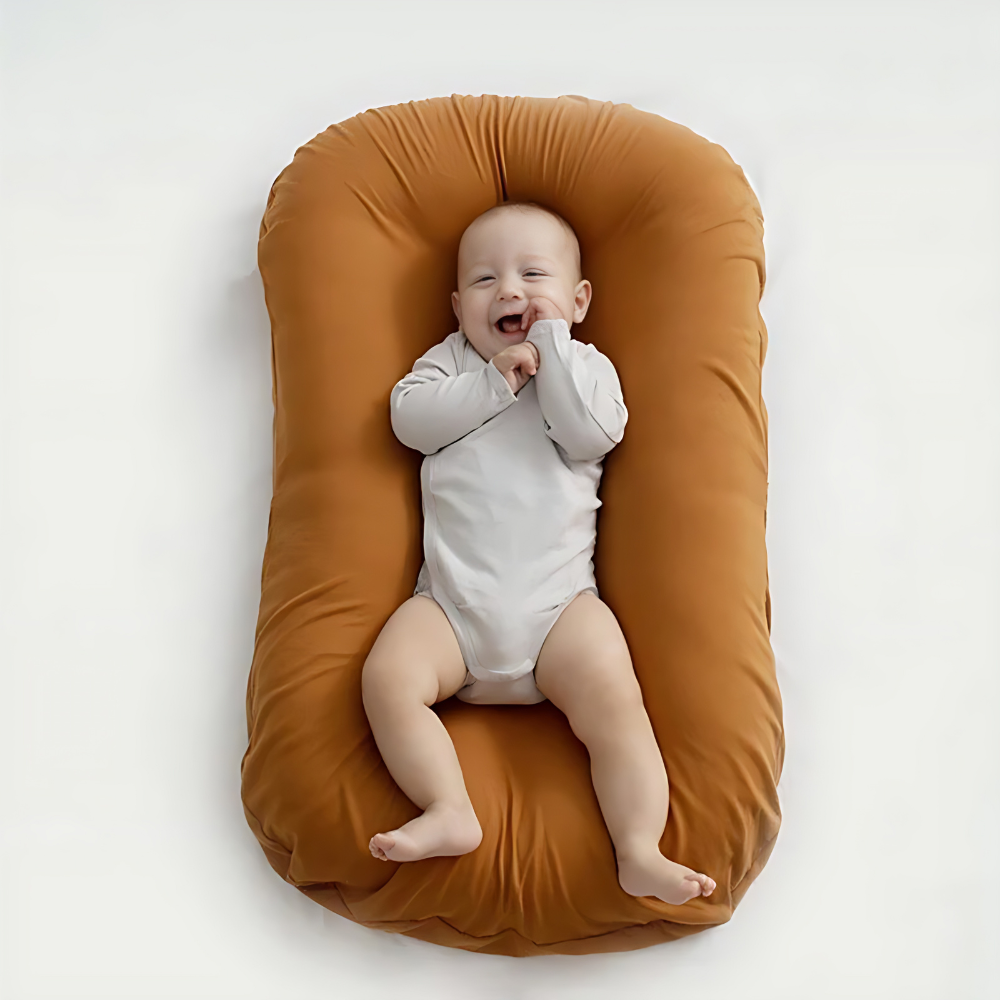 Pink baby pillow featuring ergonomic design for comfortable and healthy infant development.