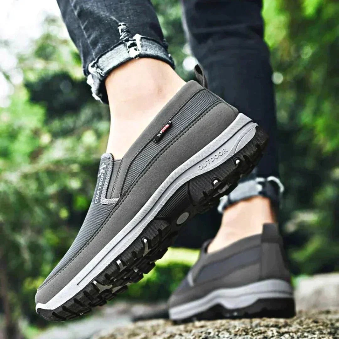 Men's fashionable slip-on orthopedic shoes in a versatile grey, ideal for casual everyday wear.