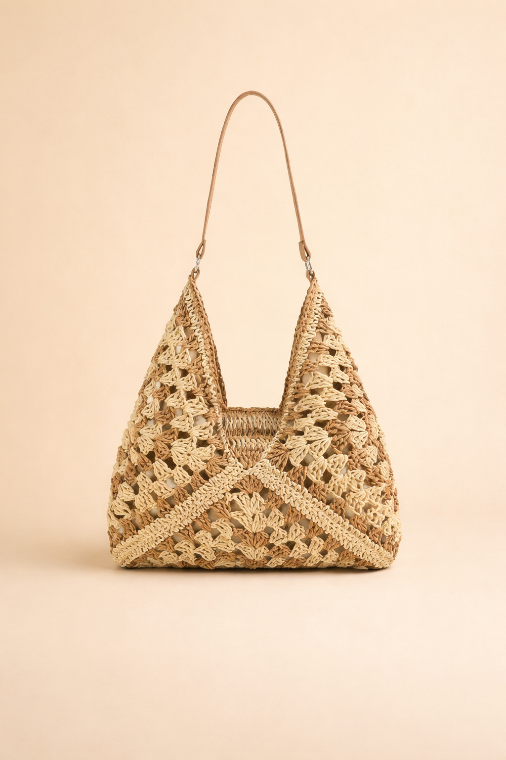 Stylish women's summer bohemian hobo bag. Woven raffia shoulder bag for casual and elegant outfits.