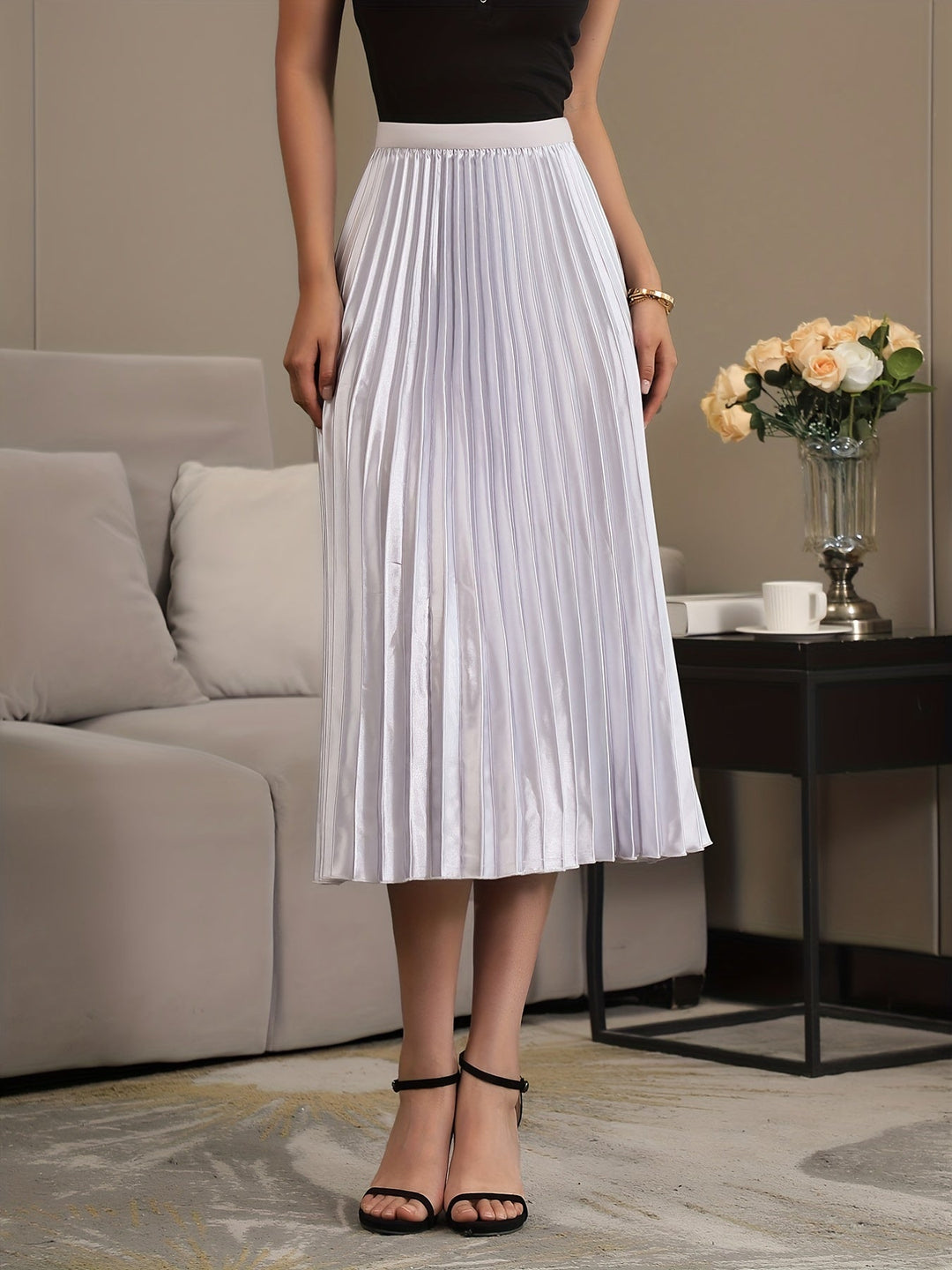 Cosy women's A-line midi skirt, pleated & chic, perfect for effortless versatile fashion.